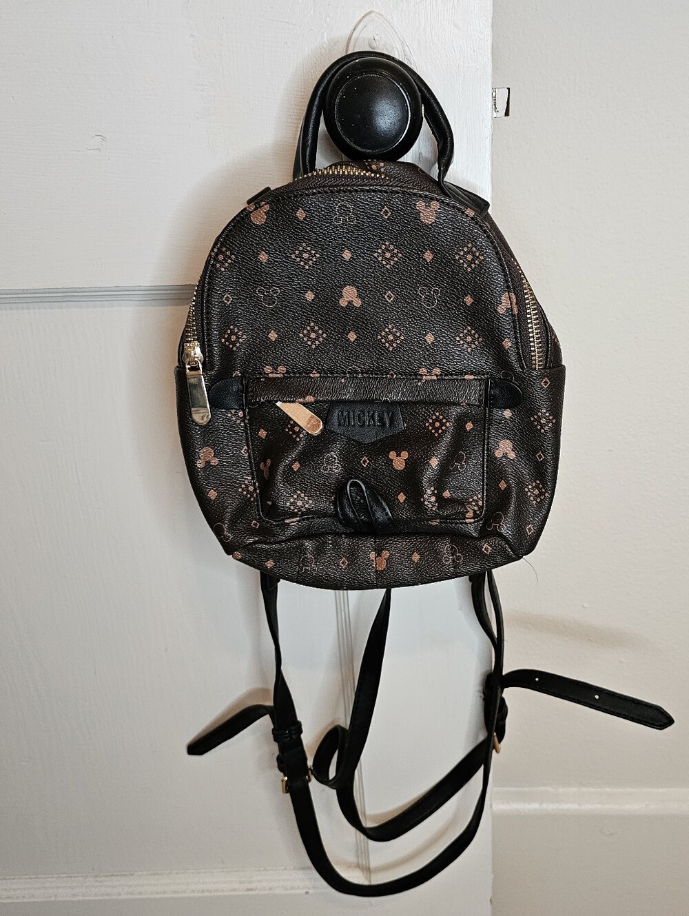Disney Mickey Mouse brown mini backpack with repeating Mickey Mouse head